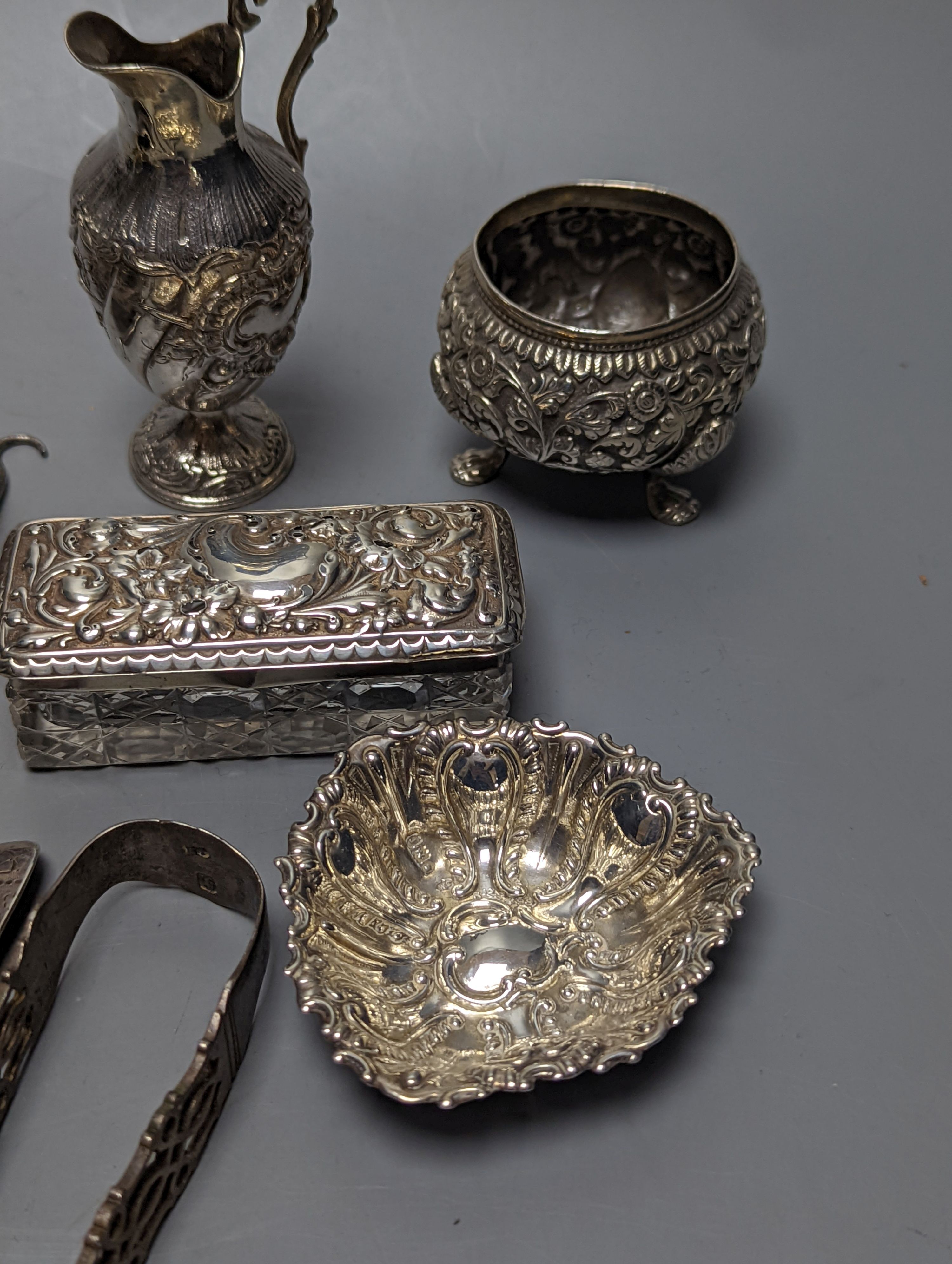 Mixed collectable small silver etc. including silver cream jug, clothes brush, mounted glass posy vase, sugar tongs, owl book mark, spoons and other items.